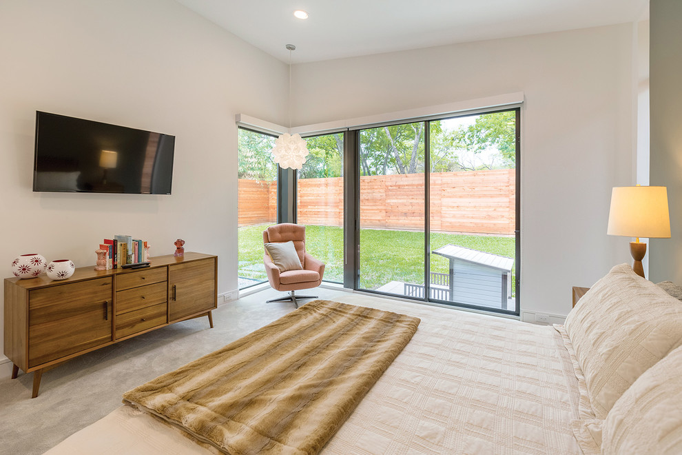 Design ideas for a midcentury master bedroom in Dallas with white walls, carpet and white floor.