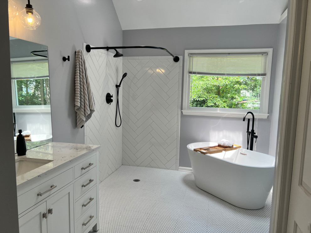 Example of a mid-sized 1950s master white tile and ceramic tile ceramic tile, white floor, single-sink and vaulted ceiling bathroom design in Raleigh with recessed-panel cabinets, white cabinets, a two-piece toilet, gray walls, a drop-in sink, quartzite countertops, white countertops and a freestanding vanity