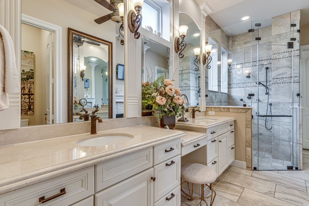 Inspiration for a french country gray tile beige floor and double-sink walk-in shower remodel in Dallas with raised-panel cabinets, white cabinets, an undermount sink, a hinged shower door, beige countertops and a built-in vanity
