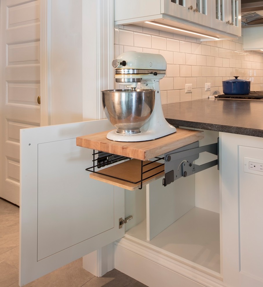 Inspiration for a mid-sized transitional u-shaped ceramic tile and gray floor enclosed kitchen remodel in DC Metro with an undermount sink, shaker cabinets, white cabinets, granite countertops, white backsplash, ceramic backsplash, stainless steel appliances, a peninsula and black countertops