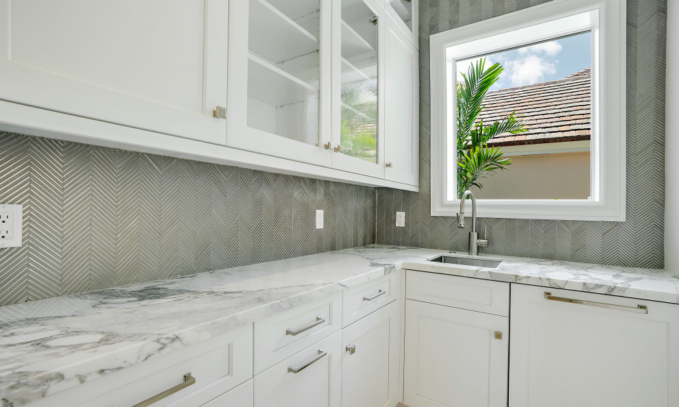 Example of a transitional laundry room design in Miami