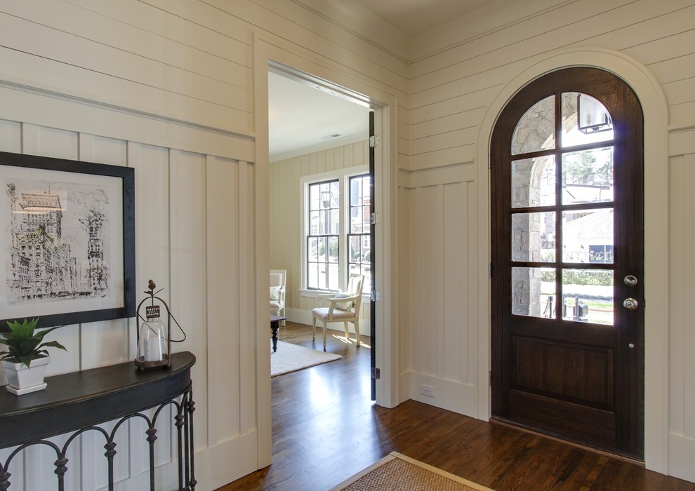 Photo of a traditional entryway in Raleigh with a single front door and a dark wood front door.