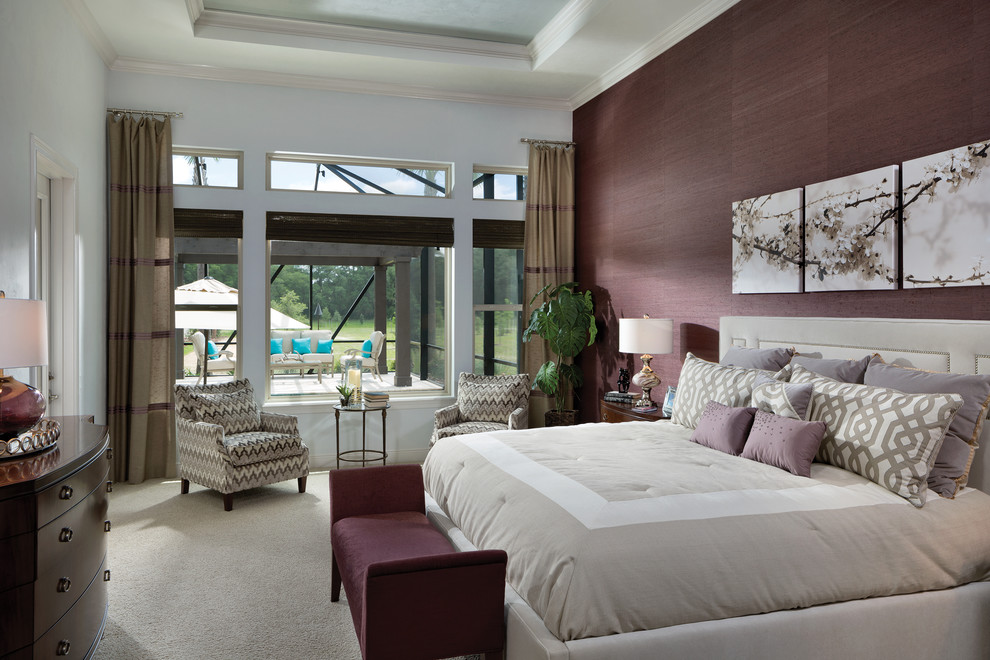 Design ideas for a large tropical master bedroom in Tampa with purple walls and carpet.