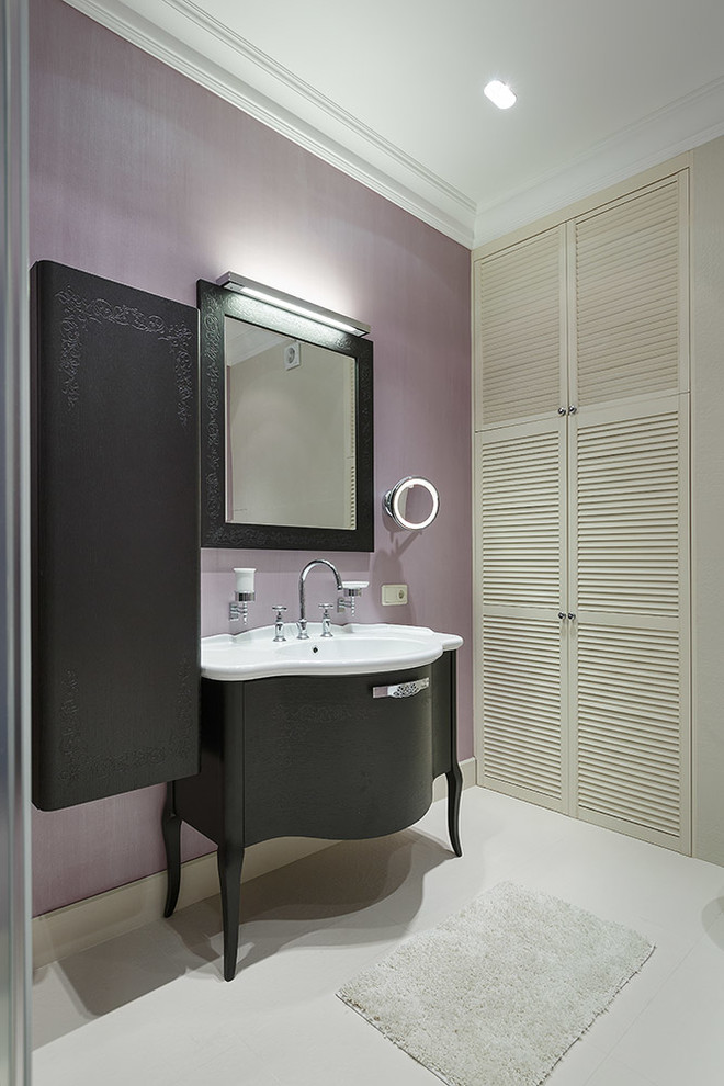 Inspiration for a traditional powder room in London with purple walls and an integrated sink.