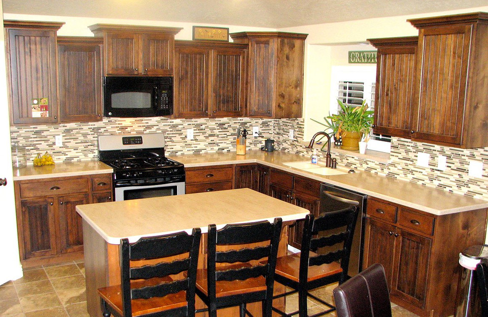 Kitchen - l-shaped ceramic tile kitchen idea in Austin with a double-bowl sink, medium tone wood cabinets, black appliances and an island