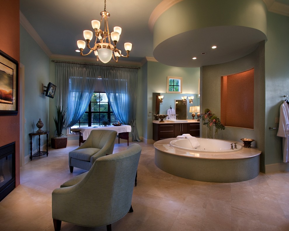 Design ideas for an expansive eclectic master bathroom in Orlando with a vessel sink, flat-panel cabinets, dark wood cabinets, marble benchtops, a drop-in tub, an alcove shower, a two-piece toilet, beige tile, stone tile, green walls and travertine floors.