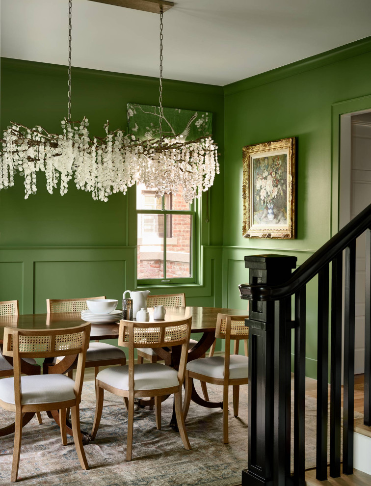 Design ideas for a transitional separate dining room in Denver with green walls.