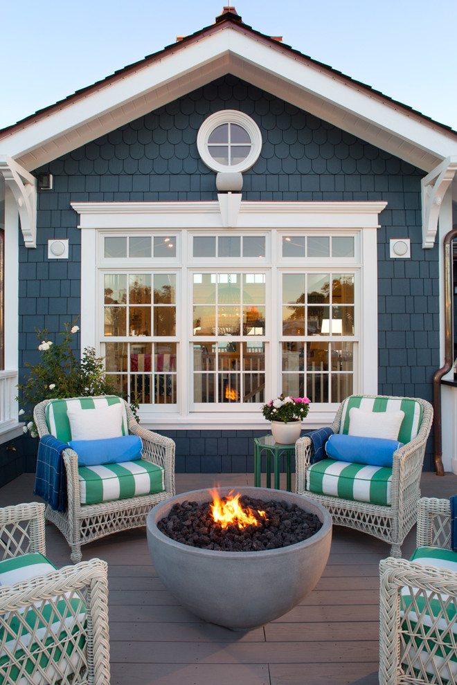 Inspiration for a beach style rooftop and rooftop deck in San Diego with a fire feature and no cover.