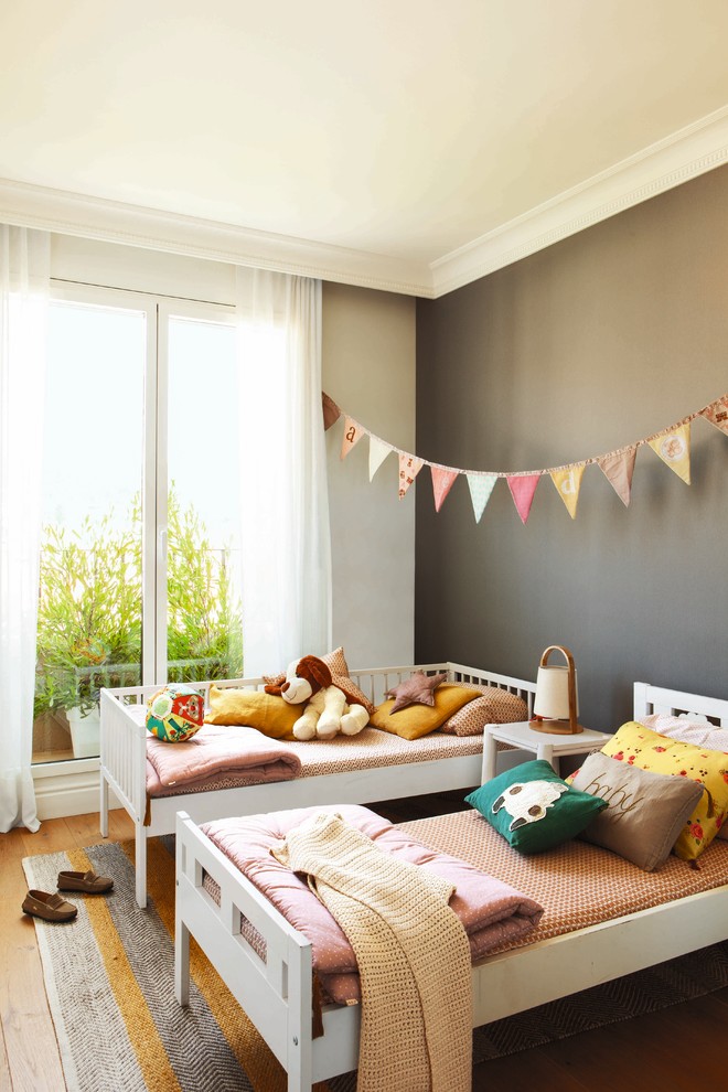 Design ideas for a large scandinavian gender-neutral kids' study room for kids 4-10 years old in Other with white walls and dark hardwood floors.