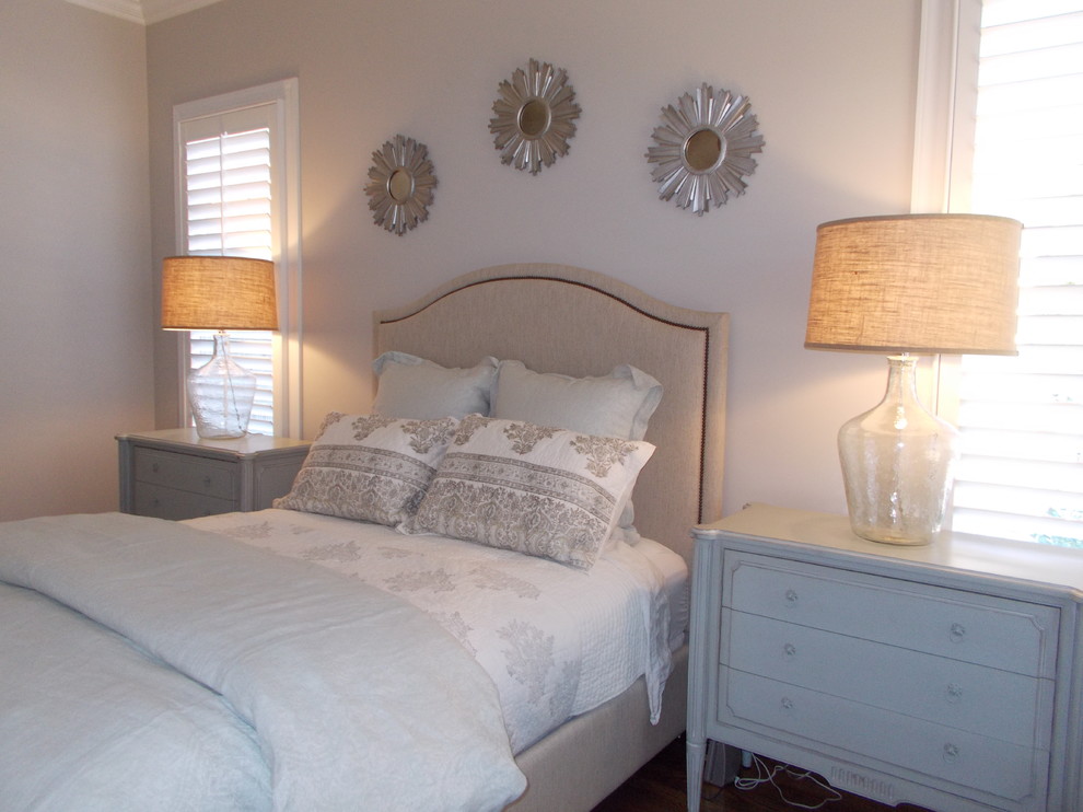 Mid-sized transitional master bedroom in Other with beige walls, dark hardwood floors and brown floor.