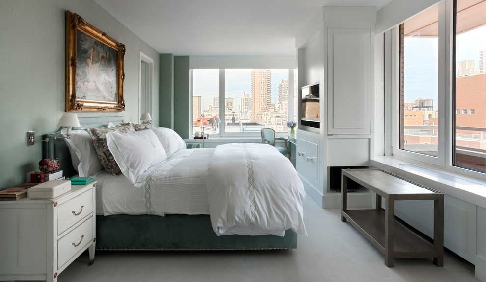 Inspiration for a transitional bedroom in New York with green walls.