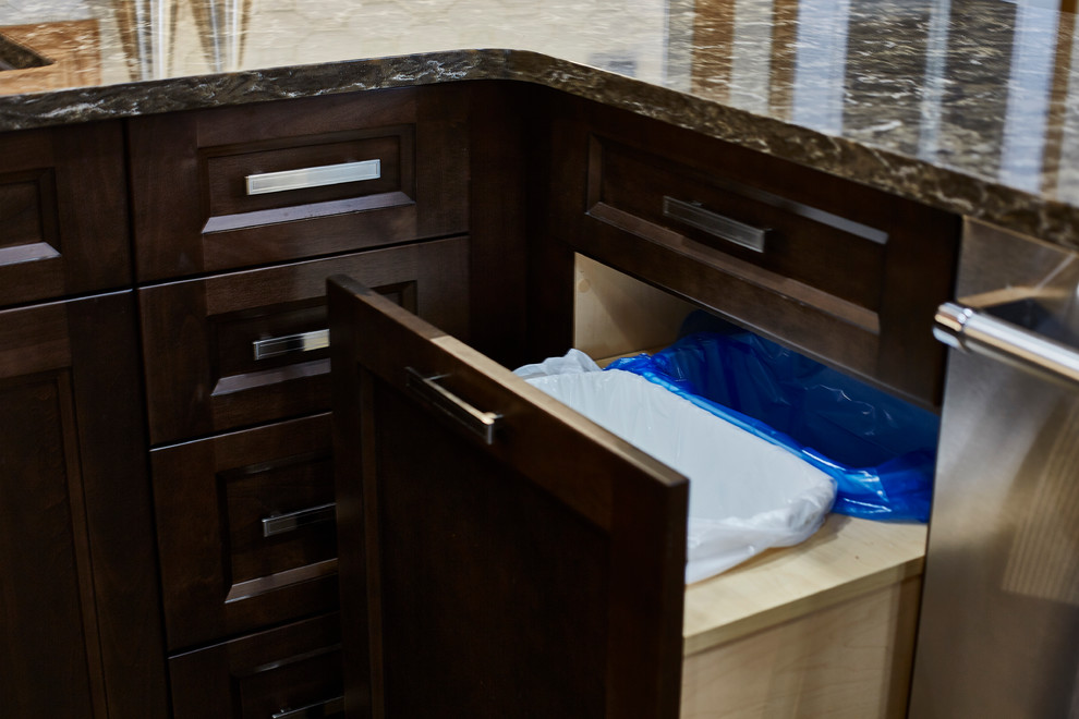Eat-in kitchen - mid-sized transitional u-shaped porcelain tile eat-in kitchen idea with an undermount sink, shaker cabinets, dark wood cabinets, quartz countertops, beige backsplash, stone tile backsplash, stainless steel appliances and a peninsula