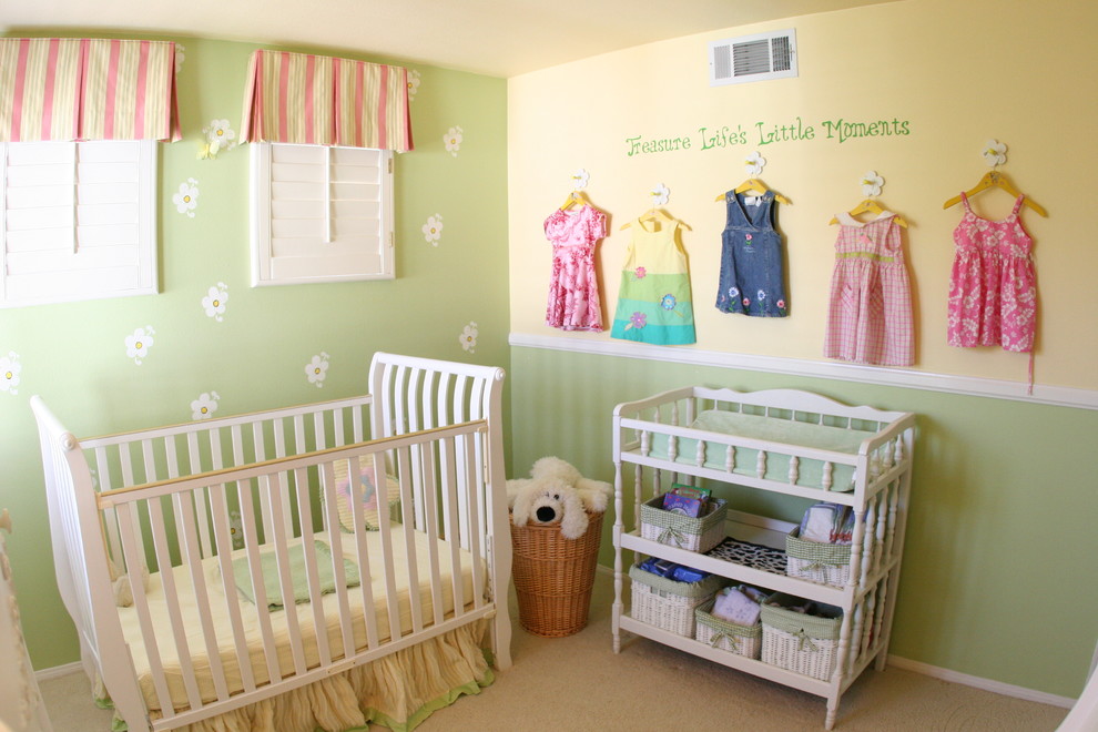 Example of a mid-sized classic girl carpeted and beige floor nursery design in Other with multicolored walls
