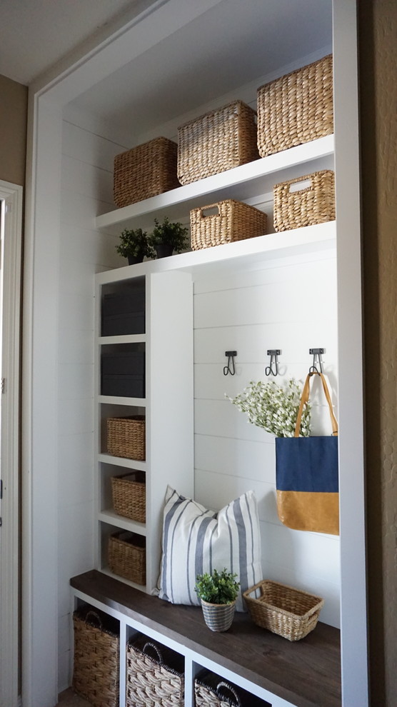 Inspiration for a small country mudroom in Phoenix with white walls, ceramic floors and beige floor.
