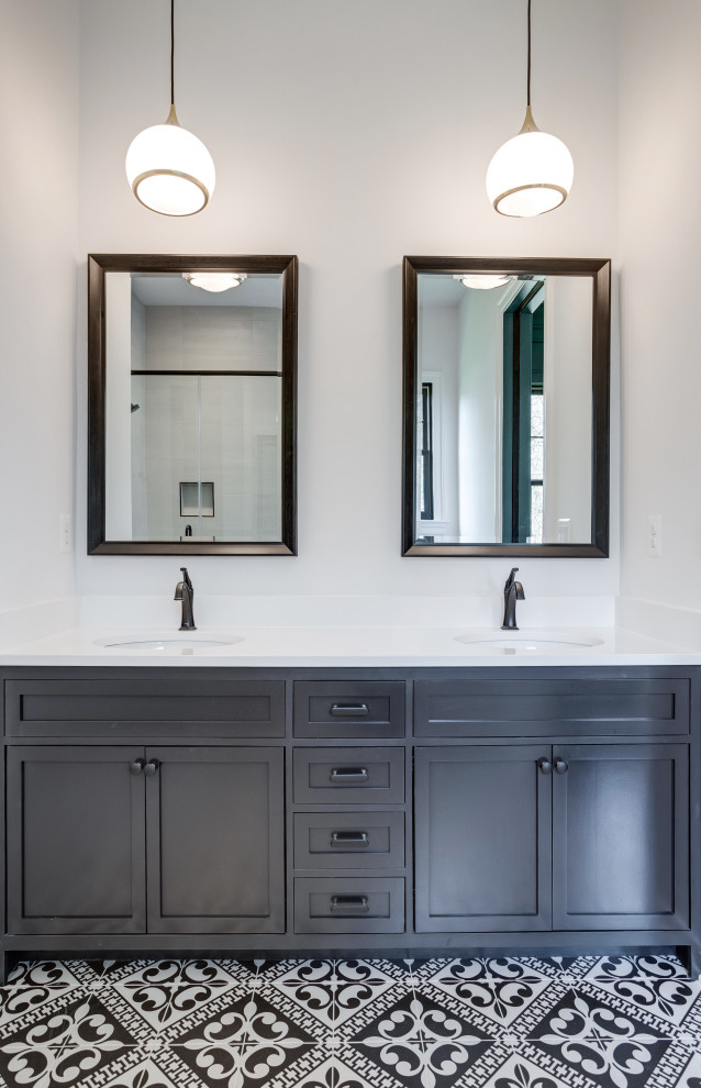 Photo of a country kids bathroom in DC Metro with shaker cabinets, black cabinets, white walls, ceramic floors, an undermount sink, solid surface benchtops, black floor, white benchtops, a single vanity and a freestanding vanity.