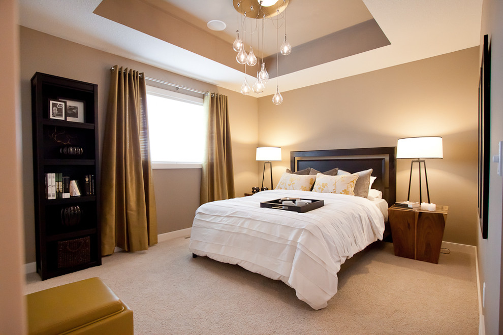 Example of a small trendy carpeted bedroom design in Calgary with beige walls
