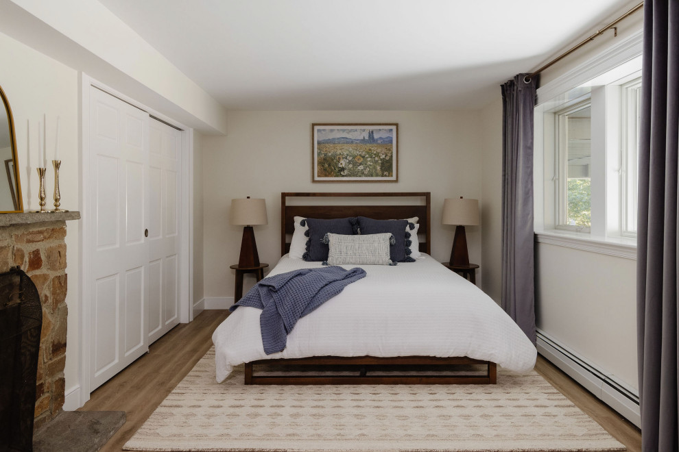 Example of a transitional bedroom design in Boston
