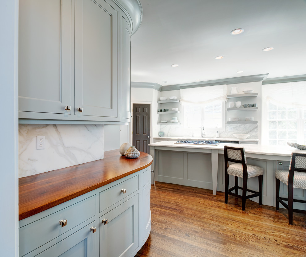 Kitchen - transitional medium tone wood floor kitchen idea in Atlanta with recessed-panel cabinets, blue cabinets and an island