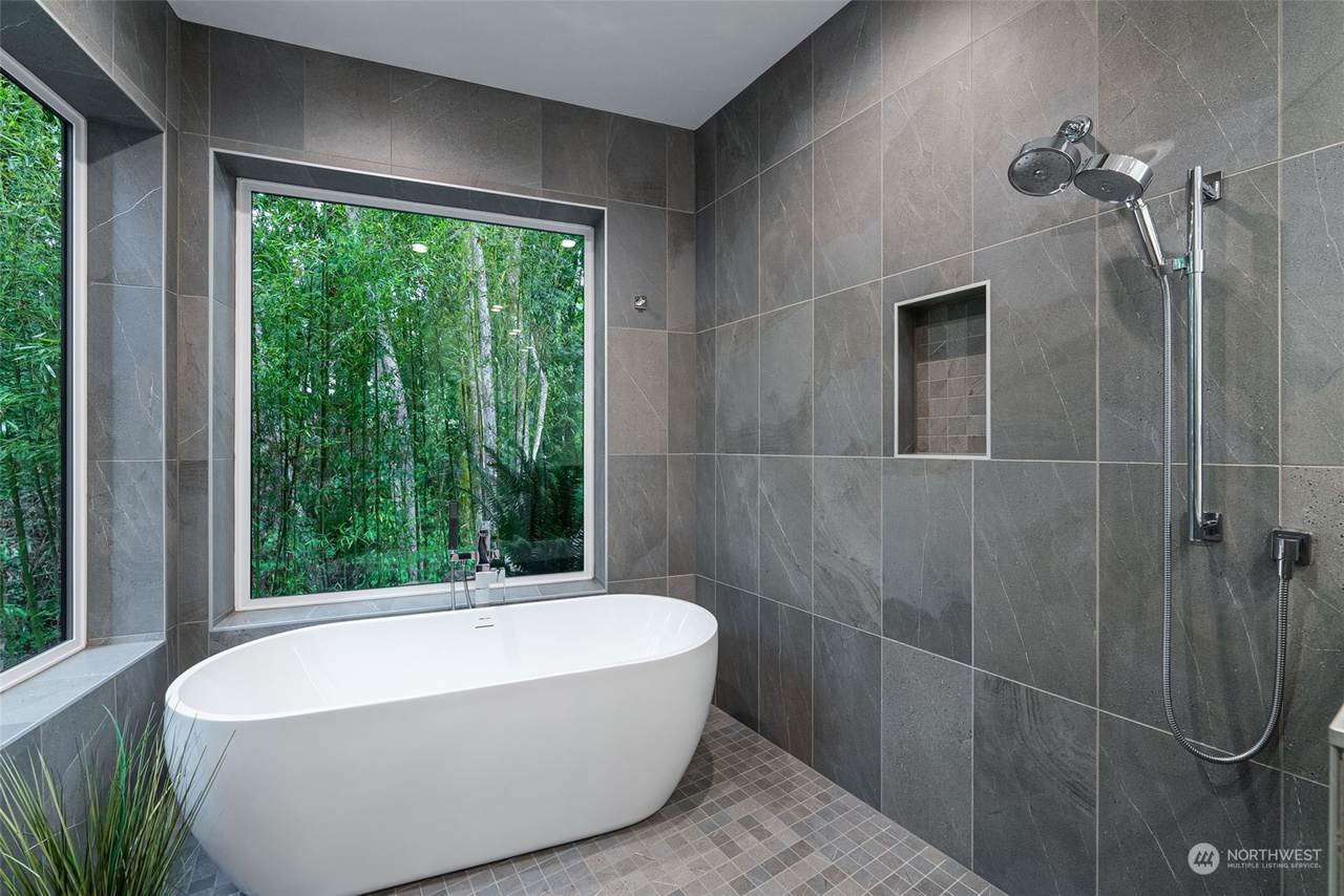 This contemporary custom home was designed to emphasize clean architectural lines, expansive natural light, and a strong connection between the indoor and outdoor living spaces. Large floor-to-ceiling