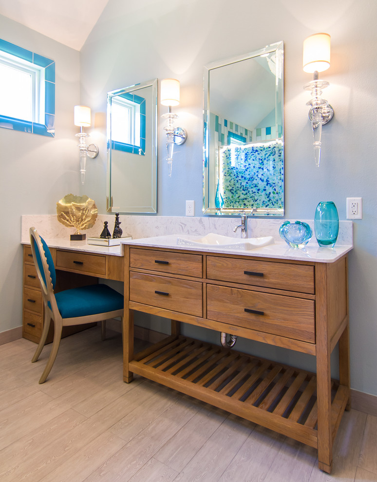 Design ideas for a large contemporary master bathroom in Houston with a vessel sink, flat-panel cabinets, light wood cabinets, limestone benchtops, a corner shower, a two-piece toilet, beige tile, glass tile, green walls and light hardwood floors.