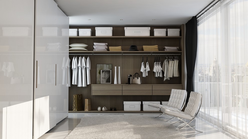 Contemporary gender-neutral dressing room in Charlotte with flat-panel cabinets, dark wood cabinets and white floor.