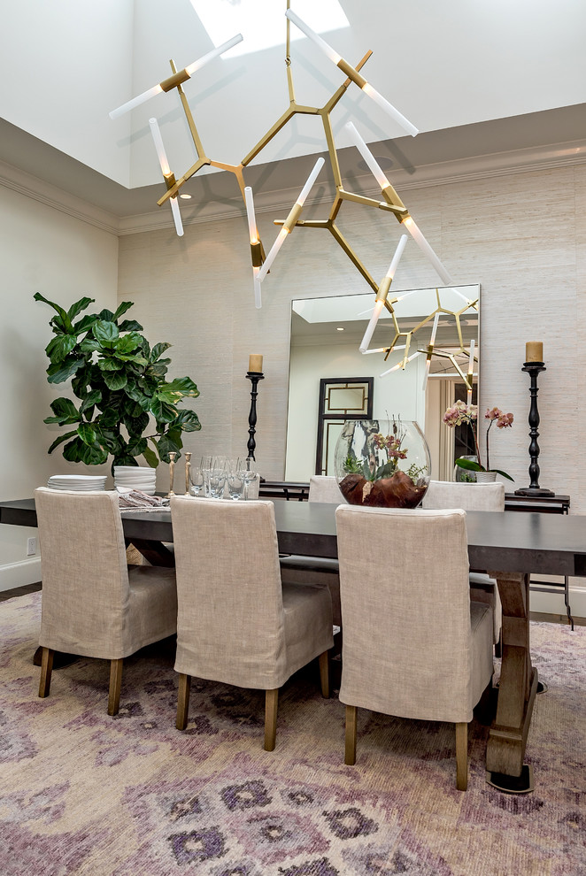 This is an example of a transitional dining room in San Francisco with beige walls and no fireplace.