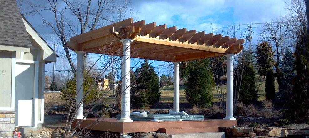 Inspiration for a mid-sized traditional backyard patio in St Louis with decking and a pergola.