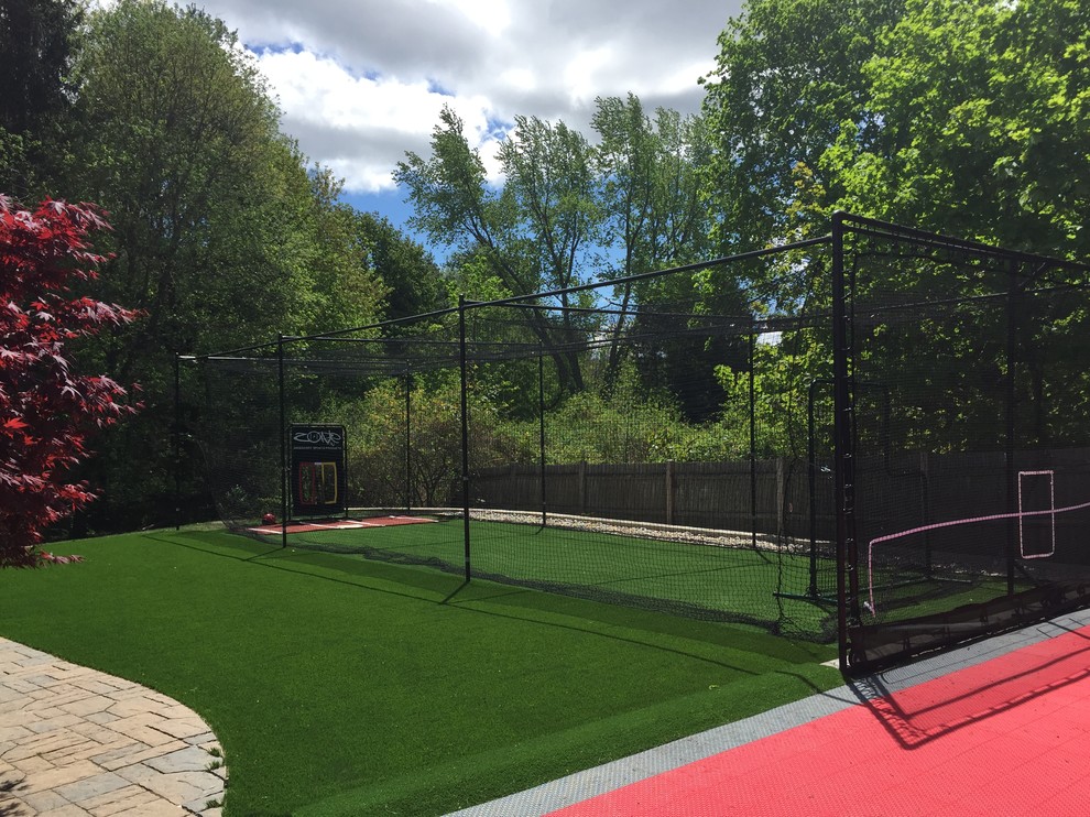Large traditional backyard outdoor sport court in Boston.