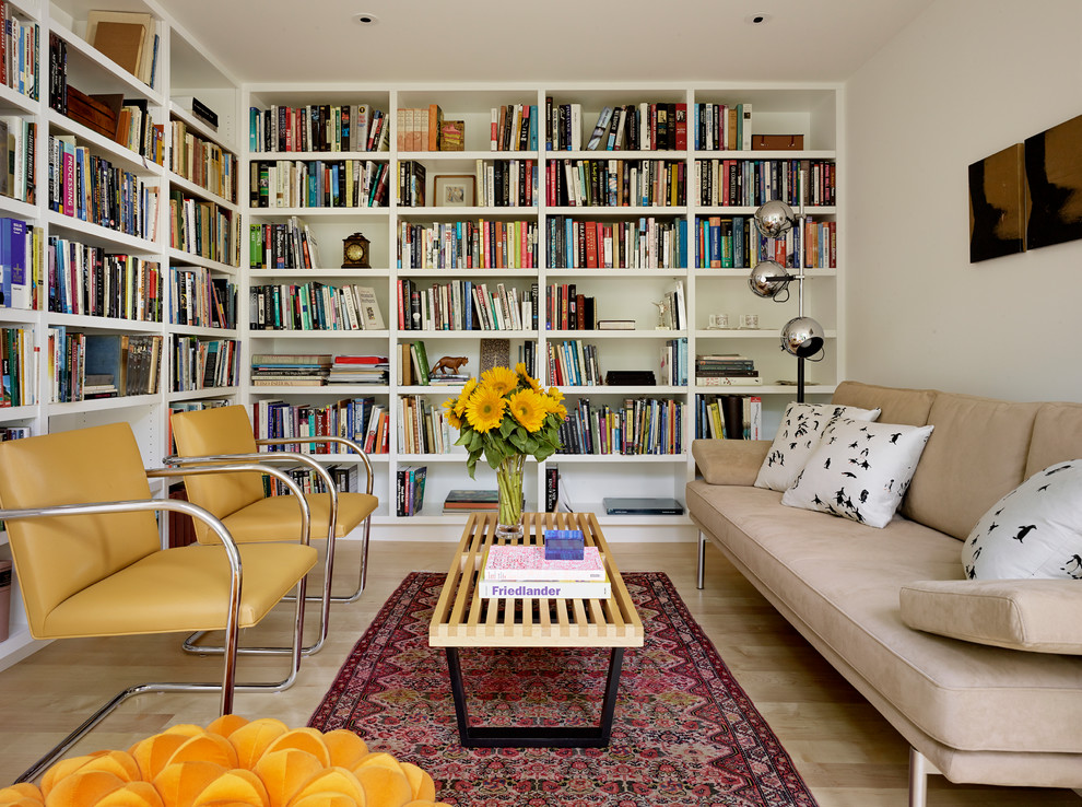 Design ideas for a small contemporary enclosed living room in San Francisco with a library, white walls, light hardwood floors, no fireplace and no tv.
