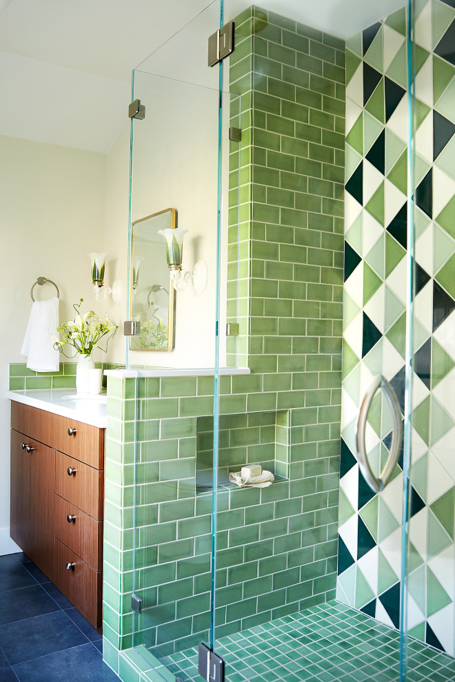 Inspiration for a large transitional master bathroom in San Francisco with medium wood cabinets, an alcove shower, green tile, ceramic tile, grey floor, a hinged shower door, white benchtops, a single vanity, flat-panel cabinets, beige walls, an undermount sink, a niche and a built-in vanity.