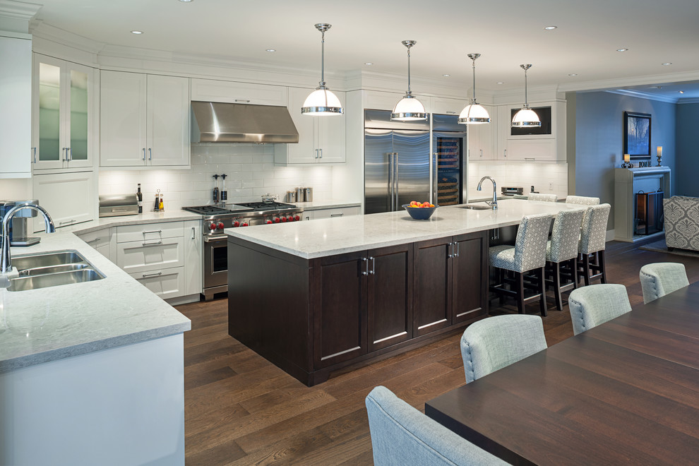 This is an example of a large transitional kitchen in Vancouver.