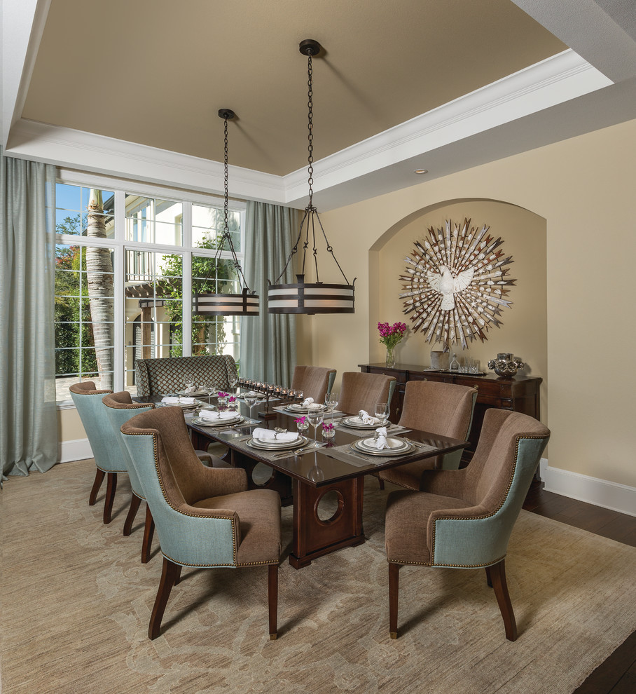 This is an example of a large transitional separate dining room in Tampa with beige walls, dark hardwood floors and no fireplace.