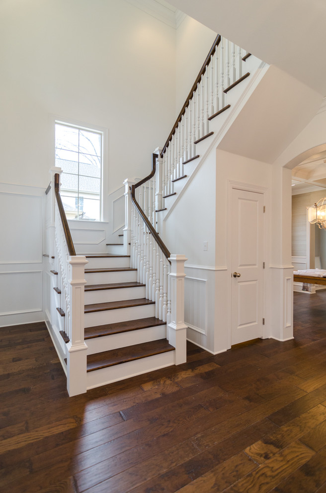 Inspiration for a traditional wood l-shaped staircase in New Orleans with wood risers.