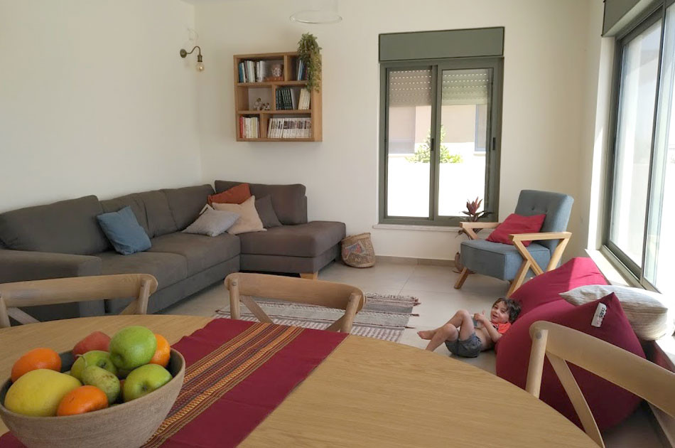 Design ideas for a mid-sized formal open concept living room in Tel Aviv with white walls, slate floors, no tv and beige floor.