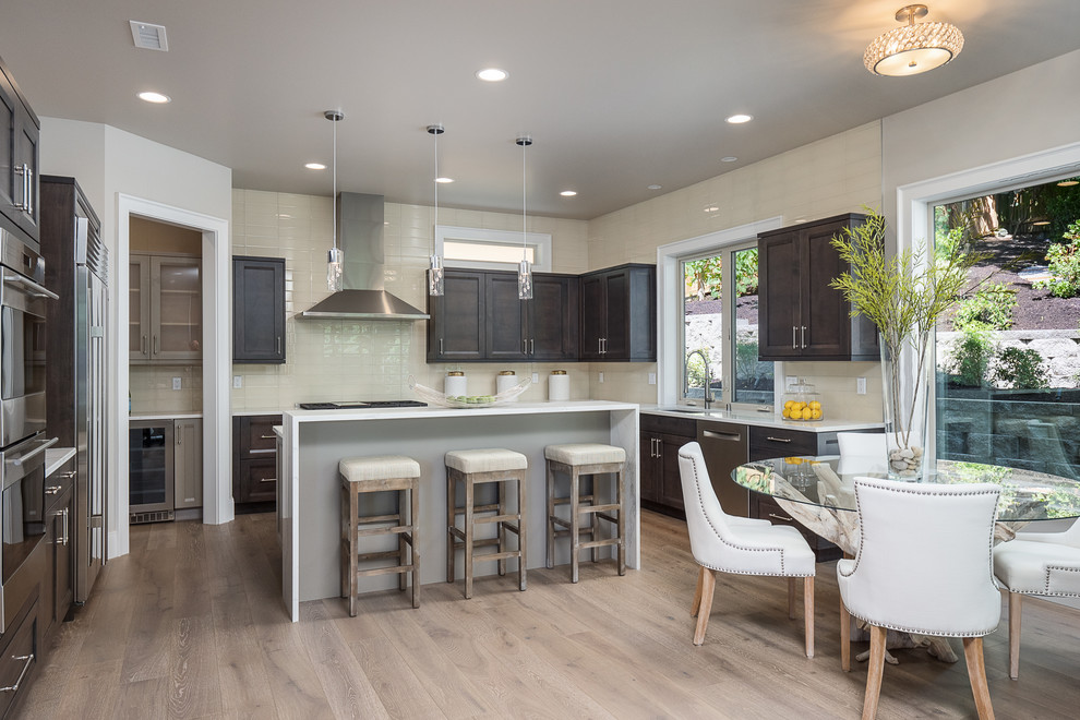 Inspiration for a transitional kitchen in Seattle with shaker cabinets and dark wood cabinets.