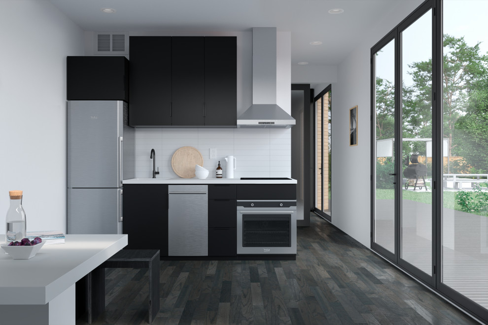 Idéer för ett modernt vit linjärt kök och matrum, med en undermonterad diskho, släta luckor, svarta skåp, bänkskiva i kvarts, vitt stänkskydd, stänkskydd i cementkakel, rostfria vitvaror, mörkt trägolv och svart golv