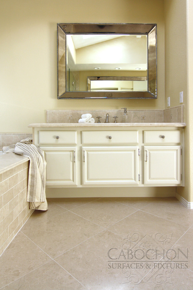 Example of a mid-sized classic master beige tile and stone tile marble floor corner shower design in San Diego with an undermount sink, an undermount tub, a two-piece toilet, shaker cabinets, beige cabinets, marble countertops and beige walls