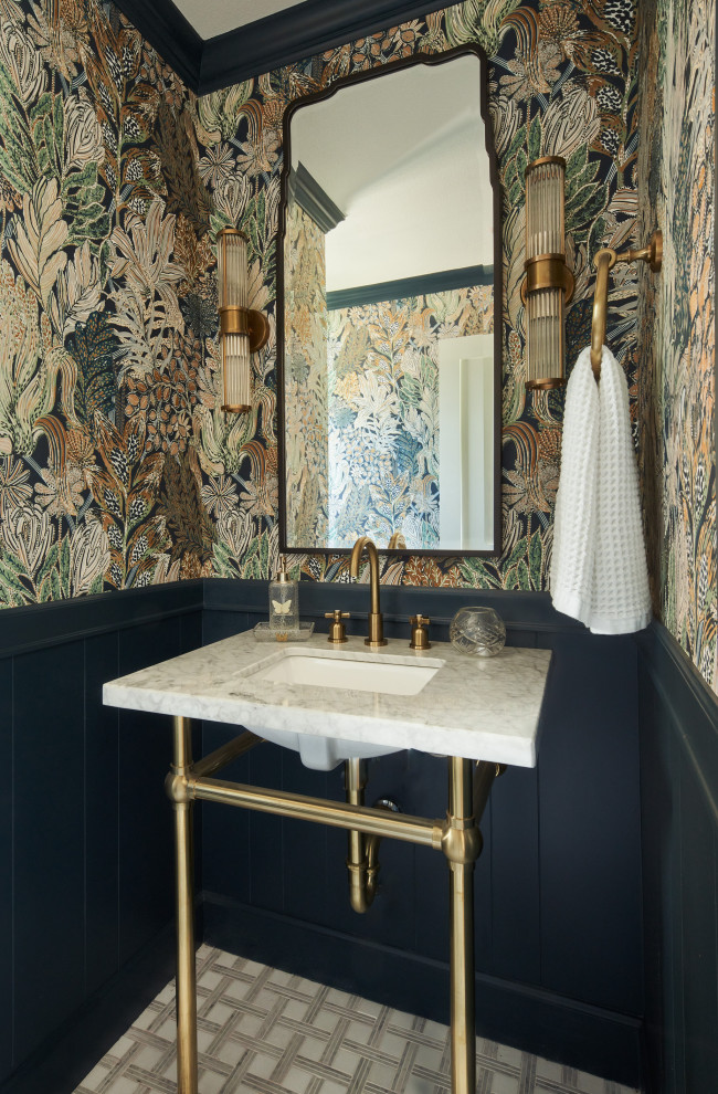 Small traditional cloakroom in Austin with a one-piece toilet, mosaic tile flooring, a submerged sink, marble worktops, white worktops, a freestanding vanity unit and wallpapered walls.