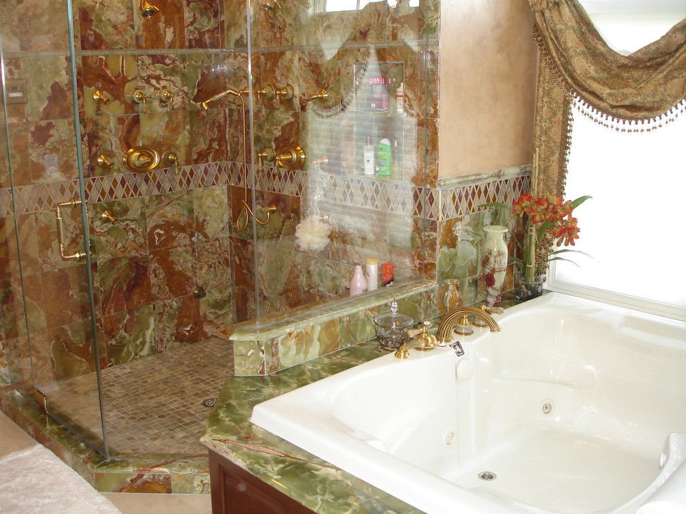 Inspiration for a large mediterranean master bathroom in New York with a drop-in tub, an open shower, beige tile, green tile, red tile, porcelain tile, beige walls and travertine floors.