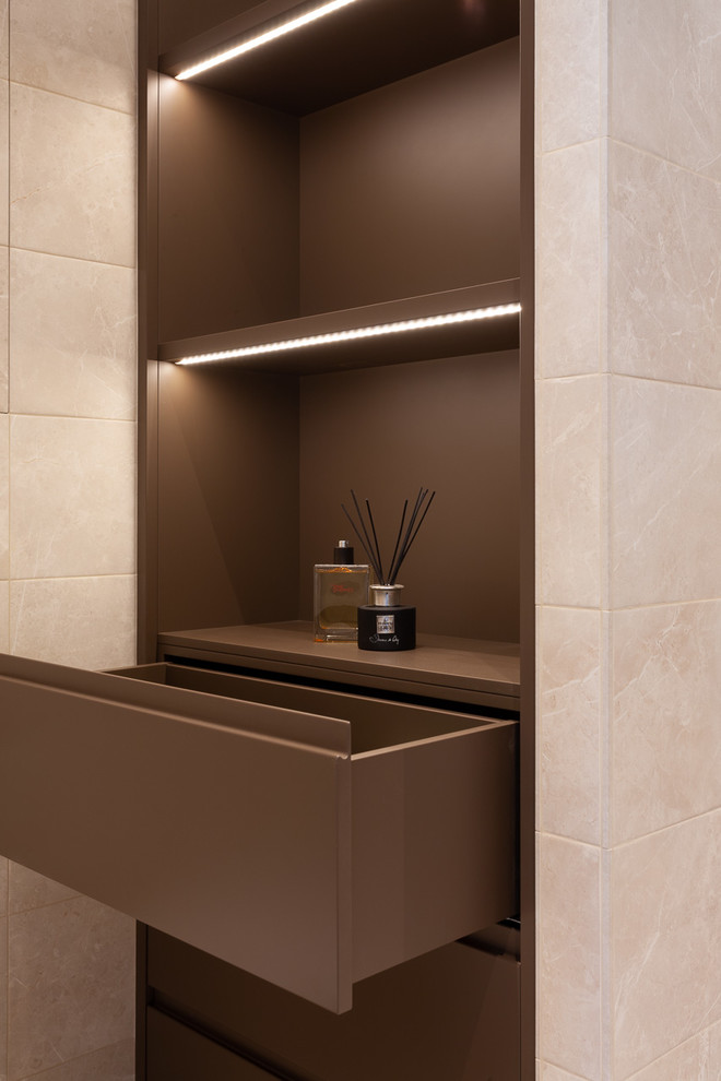 Photo of a mid-sized contemporary 3/4 bathroom in Moscow with open cabinets, grey cabinets, an alcove shower, a wall-mount toilet, beige tile, porcelain tile, beige walls, porcelain floors, an integrated sink, quartzite benchtops, beige floor, a hinged shower door and white benchtops.