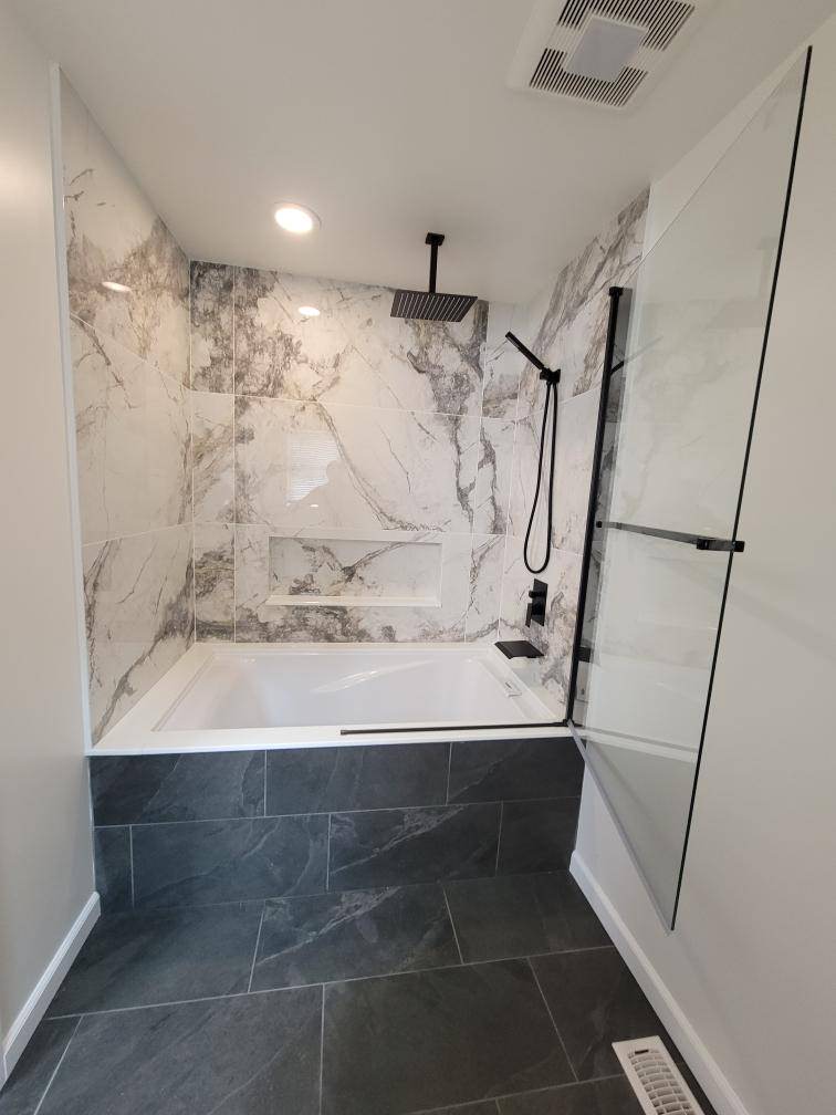 A master bathroom was added by combining a closet and hall bath.