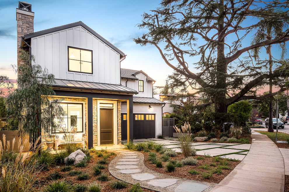 Example of a farmhouse exterior home design in Los Angeles
