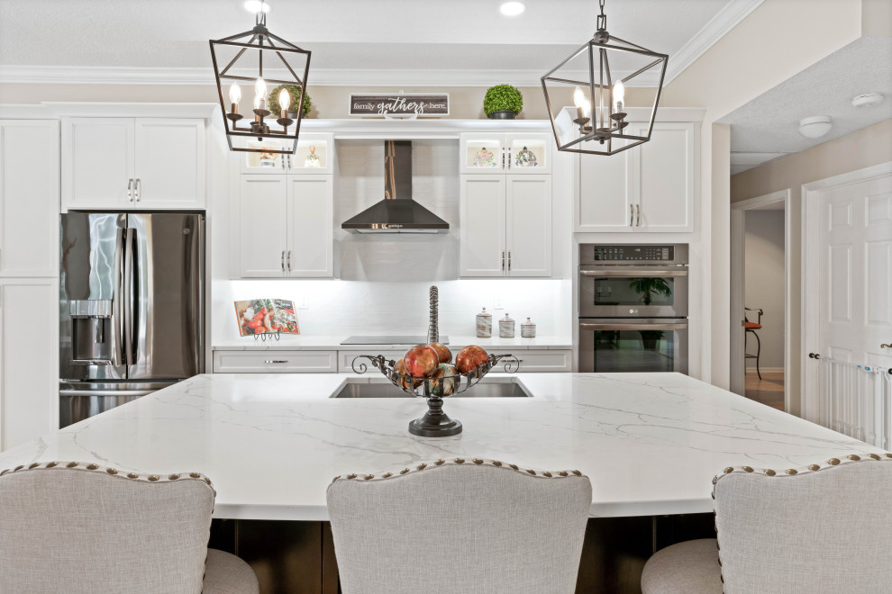 Inspiration for a mid-sized transitional single-wall porcelain tile and multicolored floor eat-in kitchen remodel with a double-bowl sink, shaker cabinets, white cabinets, quartz countertops, white backsplash, porcelain backsplash, stainless steel appliances, white countertops and an island