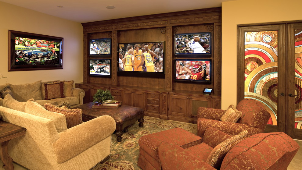 Mediterranean home theatre in Los Angeles with carpet and a wall-mounted tv.