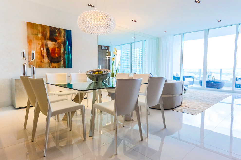 Design ideas for a mid-sized modern open plan dining in Miami with white walls and white floor.
