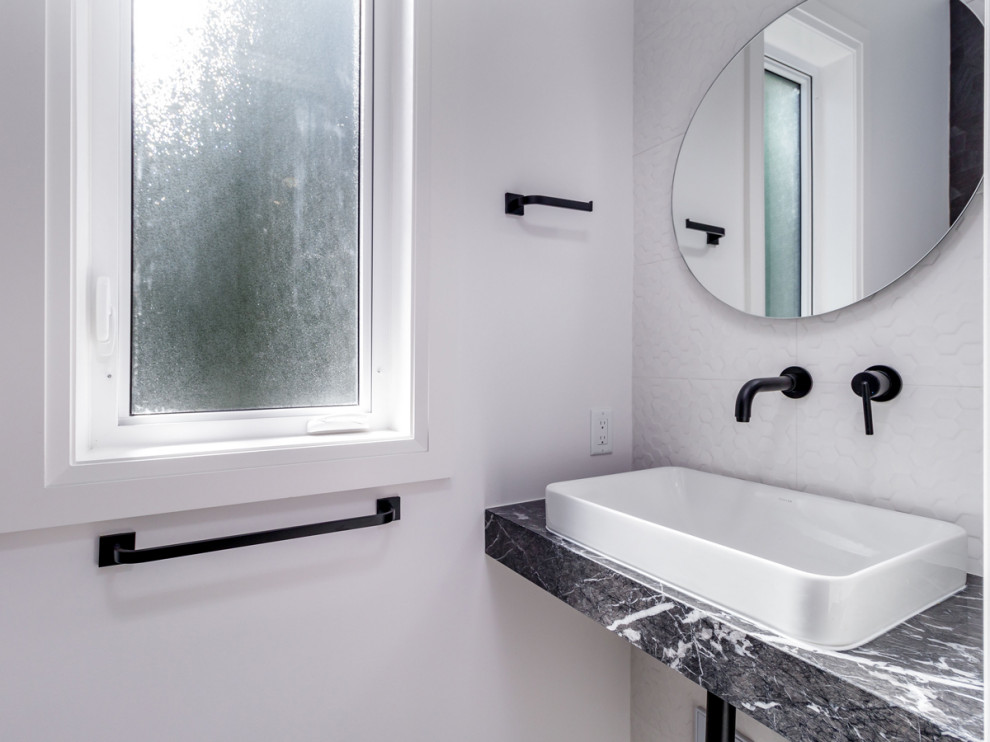Example of a transitional home design design in Vancouver