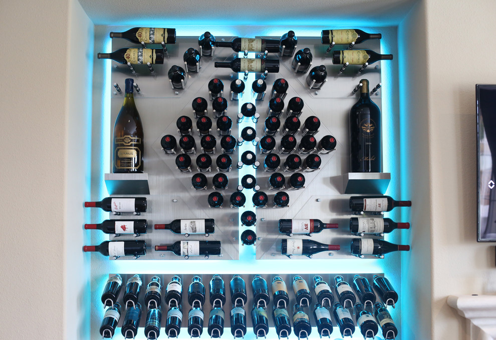 Inspiration for a small modern wine cellar in Sacramento with display racks.