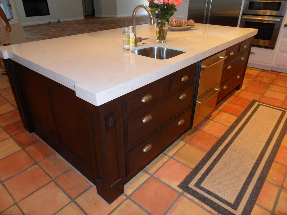 Mid-sized transitional terra-cotta tile eat-in kitchen photo in Miami with an undermount sink, raised-panel cabinets, dark wood cabinets, marble countertops, stainless steel appliances and an island