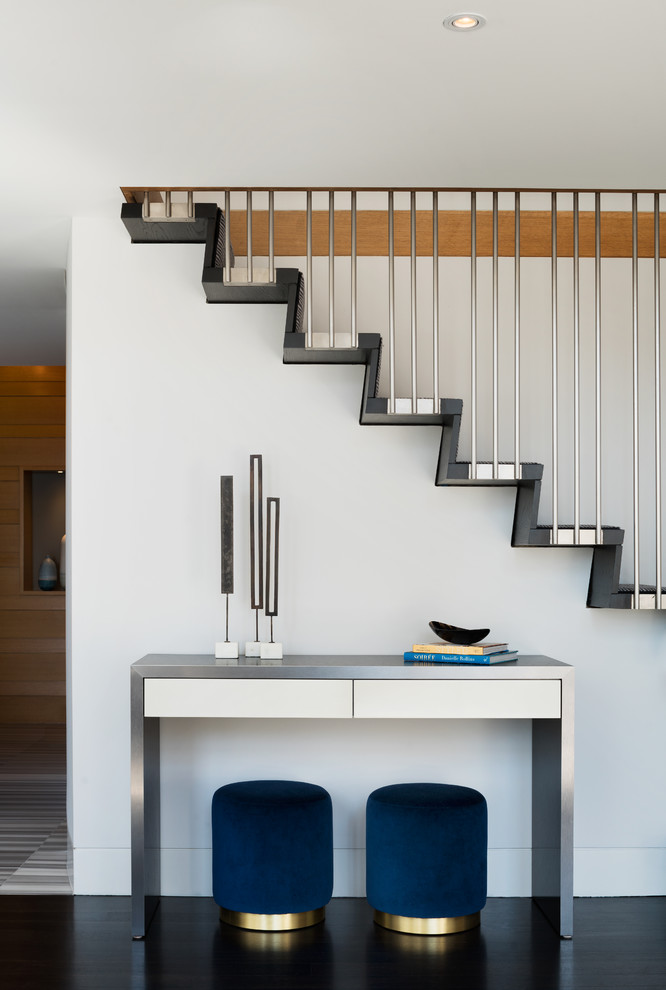 This is an example of a mid-sized contemporary straight staircase in New York.