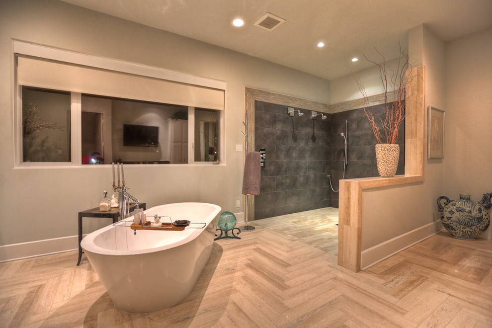 Inspiration for a contemporary bathroom in Houston with a freestanding tub and a curbless shower.